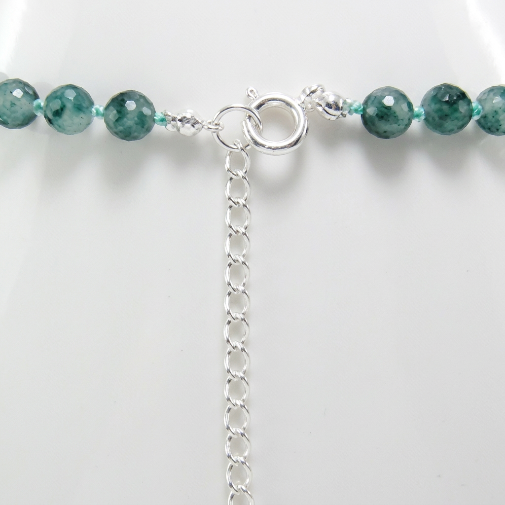 Close-up of the sterling silver spring-ring clasp and extension chain with green candy jade beads.